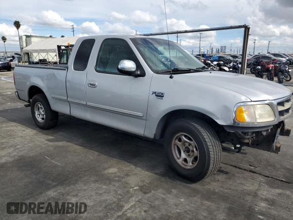 1998 Ford F-150 XL with VIN 1FTRX17L3WKB36791, listed as a Copart auction lot 42141915 with 201,067 mi miles and Salvage title. Bid and sale history available at DreamBid. Image 4.