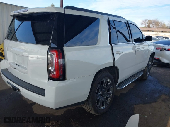 2019 GMC Yukon SLT with VIN 1GKS2BKC5KR109529, listed as a IAAI auction lot 41559860 with 136,025 mi miles. Bid and sale history available at carsss.com. Image 4.