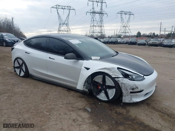 2021 Tesla Model 3 Performance with VIN 5YJ3E1EC5MF059625, listed as a IAAI auction lot 41652748 with 63,287 mi miles. Bid and sale history available at carsss.com. Image 6.