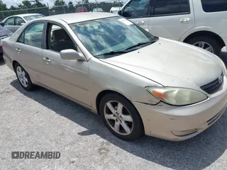 2002 Toyota Camry LE z VIN 4T1BE32K12U565567, wystawiony jako IAAI lot #42359472 z przebiegiem 216 343 mil mil oraz . Historia ofert i sprzedaży dostępna na DreamBid. Obrazek 1.