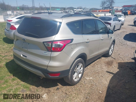 2017 Ford Escape SE with VIN 1FMCU0GD3HUC94245, listed as a IAAI auction lot 41877799 with 214,571 mi miles. Bid and sale history available at carsss.com. Image 4.