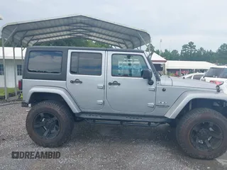 2016 Jeep Wrangler Unlimited Sahara with VIN 1C4BJWEG5GL117872, listed as a IAAI auction lot 42692798 with 119,819 mi miles and . Bid and sale history available at DreamBid. Image 13.