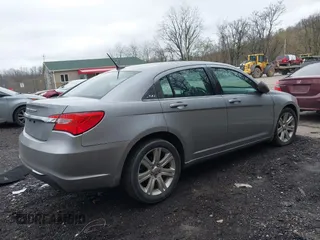 2014 Chrysler 200 Touring with VIN 1C3CCBBB1EN165049, listed as a IAAI auction lot 42005572 with 117,673 mi miles and . Bid and sale history available at carsss.com. Image 4.