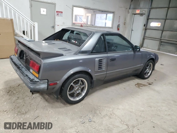 1989 Toyota MR2 z VIN JT2AW15C1K0150268, wystawiony jako Copart lot #86257134 z przebiegiem 93 969 mil mil oraz Tytuł czysty. Historia ofert i sprzedaży dostępna na DreamBid. Obrazek 3.