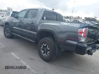 2021 Toyota Tacoma SR z VIN 3TMCZ5AN9MM397611, wystawiony jako IAAI lot #41467705 z przebiegiem 65 191 mil mil oraz . Historia ofert i sprzedaży dostępna na DreamBid. Obrazek 3.