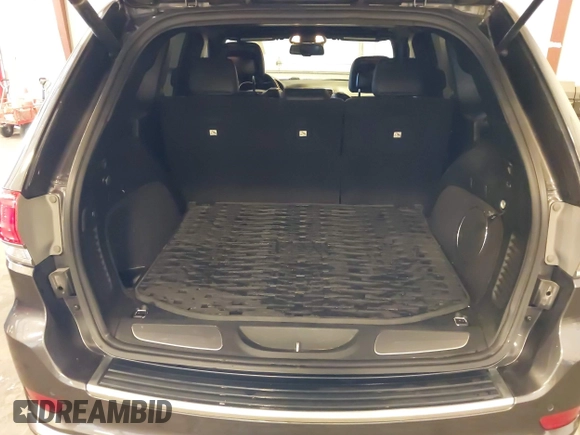 2015 Jeep Grand Cherokee Summit with VIN 1C4RJFJG4FC634129, listed as a IAAI auction lot 42481877 with 149,087 mi miles and . Bid and sale history available at DreamBid. Image 18.