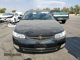 2000 Toyota Solara SE with VIN 2T1CF28P0YC337293, listed as a Copart auction lot 70659044 with 214,172 mi miles and Salvage Title. Bid and sale history available at carsss.com. Image 5.