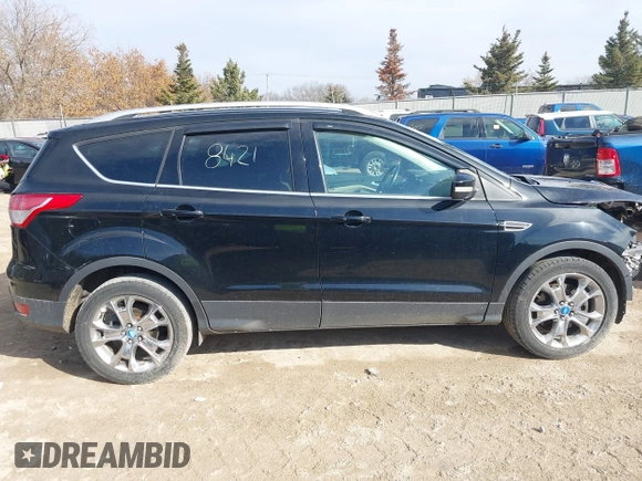2016 Ford Escape Titanium with VIN 1FMCU9JX4GUB38303, listed as a IAAI auction lot 41788421 with 138,511 mi miles and . Bid and sale history available at DreamBid. Image 14.
