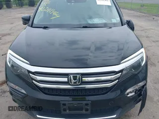 2017 Honda Pilot Touring with VIN 5FNYF6H90HB052474, listed as a IAAI auction lot 42291464 with 103,288 mi miles and . Bid and sale history available at DreamBid. Image 12.