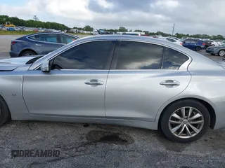 2015 Infiniti Q50 Premium with VIN JN1BV7AP9FM358782, listed as a IAAI auction lot 41103963 with 96,853 mi miles. Bid and sale history available at carsss.com. Image 15.