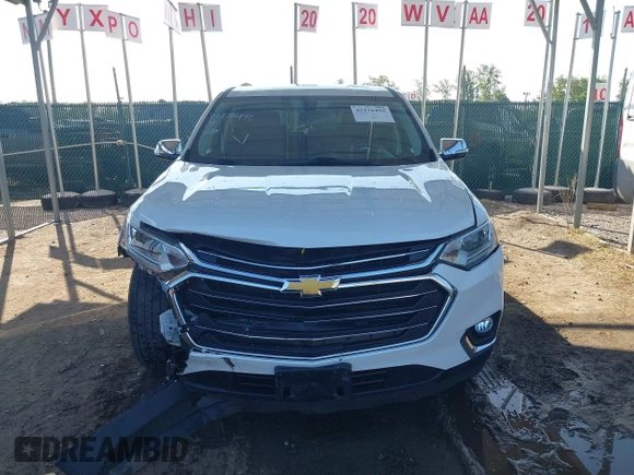 2018 Chevrolet Traverse LT Cloth z VIN 1GNEVGKWXJJ270664, wystawiony jako IAAI lot #42176492 z przebiegiem 73 534 mil mil oraz . Historia ofert i sprzedaży dostępna na DreamBid. Obrazek 13.