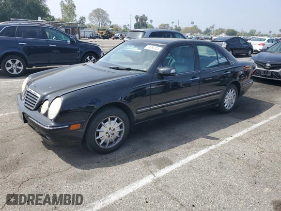2002 Mercedes-Benz E-Class with VIN WDBJF82JX2X064384, listed as a Copart auction lot 53058325 with 188,440 mi miles and Salvage Title. Bid and sale history available at carsss.com. Image 1.