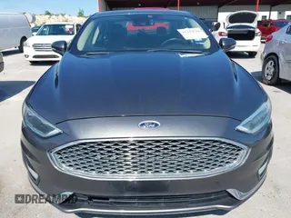 2019 Ford Fusion Titanium with VIN 3FA6P0D91KR104827, listed as a IAAI auction lot 42221526 with 141,316 mi miles and . Bid and sale history available at DreamBid. Image 12.