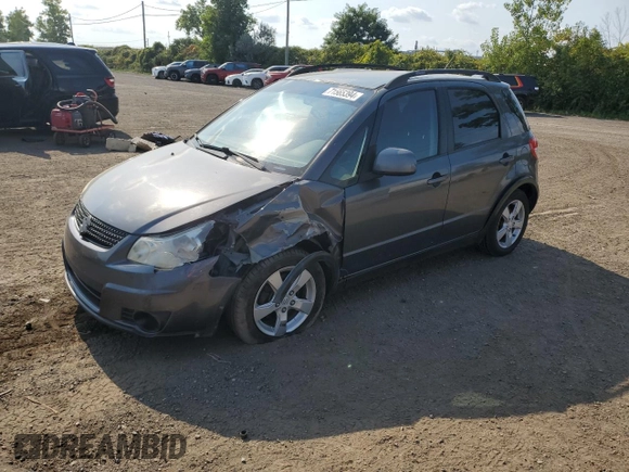 2010 Suzuki SX4 with VIN JS2YB5A24A6300249, listed as a Copart auction lot 71565394 with 291,886 mi miles and Salvage Title. Bid and sale history available at DreamBid. Image 1.