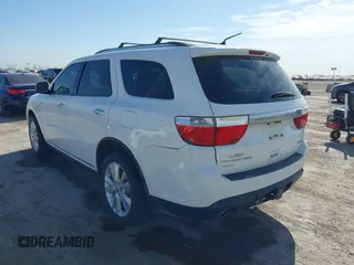2013 Dodge Durango Crew with VIN 1C4SDJDT6DC510333, listed as a IAAI auction lot 41776099 with 180,431 mi miles and . Bid and sale history available at DreamBid. Image 3.
