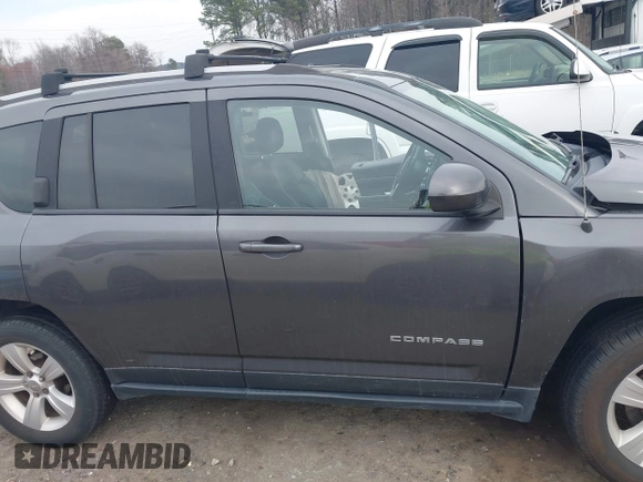 2016 Jeep Compass Latitude with VIN 1C4NJDEB4GD687300, listed as a IAAI auction lot 41800186 with 169,374 mi miles. Bid and sale history available at carsss.com. Image 13.