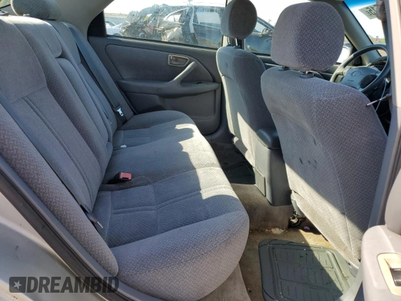 2000 Toyota Camry CE z VIN 4T1BG22K2YU711908, wystawiony jako Copart lot #56294515 z przebiegiem 110 871 mil mil oraz Szkoda całkowita • Salvage title. Historia ofert i sprzedaży dostępna na DreamBid. Obrazek 10.