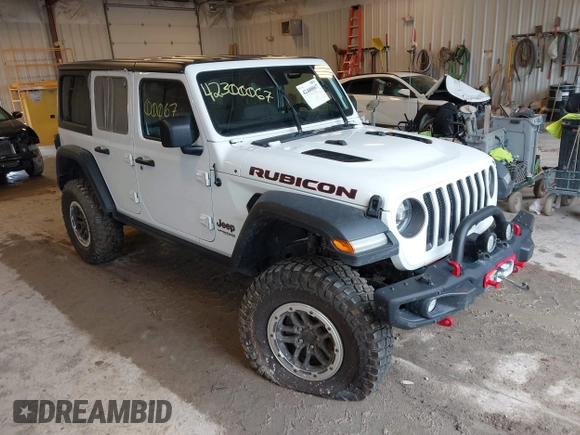 2022 Jeep Wrangler Unlimited Rubicon with VIN 1C4JJXFM0NW154202, listed as a IAAI auction lot 42400067 with 60,486 mi miles and . Bid and sale history available at DreamBid. Image 1.