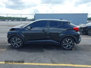 2019 Toyota C-HR XLE with VIN NMTKHMBX4KR096569, listed as a IAAI auction lot 42147017 with 111,569 mi miles and . Bid and sale history available at DreamBid. Image 14.