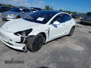 2020 Tesla Model 3 Standard Range Plus with VIN 5YJ3E1EA8LF783631, listed as a IAAI auction lot 40696383 with 78,889 mi miles. Bid and sale history available at carsss.com. Image 16.