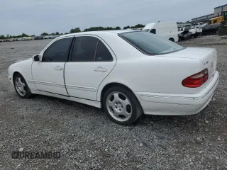2001 Mercedes-Benz E-Class with VIN WDBJF70J51B332881, listed as a Copart auction lot 63487844 with 216,080 mi miles and Salvage Title. Bid and sale history available at carsss.com. Image 2.