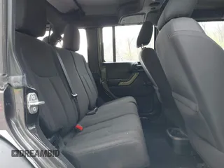 2018 Jeep Wrangler JK Unlimited Sport S with VIN 1C4BJWDG8JL895981, listed as a IAAI auction lot 42048316 with 95,457 mi miles. Bid and sale history available at carsss.com. Image 8.