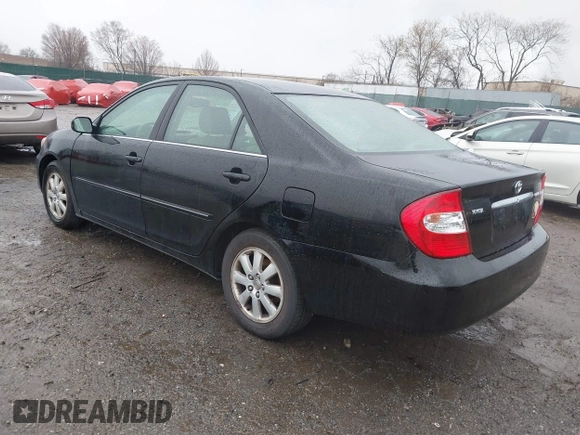2003 Toyota Camry LE with VIN 4T1BE30K13U144114, listed as a IAAI auction lot 41829879 with 60,385 mi miles and . Bid and sale history available at DreamBid. Image 3.
