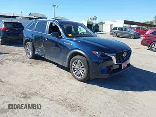 2024 Mazda CX-90 Select z VIN JM3KKAHDXR1170154, wystawiony jako IAAI lot #40852871 z przebiegiem 4 498 mil mil oraz . Historia ofert i sprzedaży dostępna na DreamBid. Obrazek 1.
