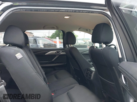 2021 Mazda CX-9 Sport with VIN JM3TCABY6M0522352, listed as a IAAI auction lot 42613136 with 106,167 mi miles and . Bid and sale history available at DreamBid. Image 8.