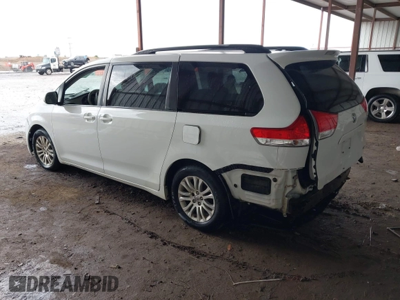 2014 Toyota Sienna XLE with VIN 5TDYK3DC6ES444121, listed as a IAAI auction lot 42110190 with 240,366 mi miles and . Bid and sale history available at DreamBid. Image 3.