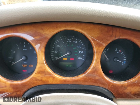 1999 Jaguar XJ with VIN SAJHX1044XC865054, listed as a Copart auction lot 57825325 with 71,145 mi miles and Clean title. Bid and sale history available at DreamBid. Image 9.