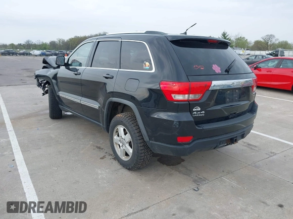 2011 Jeep Grand Cherokee Laredo z VIN 1J4RR4GG8BC504878, wystawiony jako IAAI lot #42097973 z przebiegiem 190 583 mil mil oraz . Historia ofert i sprzedaży dostępna na DreamBid. Obrazek 3.