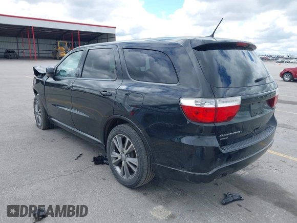 2013 Dodge Durango SXT with VIN 1C4RDJAG4DC697450, listed as a IAAI auction lot 42336657 with 177,476 mi miles and . Bid and sale history available at DreamBid. Image 3.