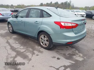 2012 Ford Focus SEL with VIN 1FAHP3H29CL430964, listed as a IAAI auction lot 42186057 with 122,279 mi miles. Bid and sale history available at carsss.com. Image 3.