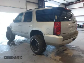 2012 GMC Yukon SLT with VIN 1GKS2CE03CR134986, listed as a IAAI auction lot 41352570 with 141,098 mi miles. Bid and sale history available at carsss.com. Image 3.