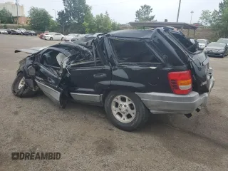 2000 Jeep Grand Cherokee Laredo with VIN 1J4G248S4YC390675, listed as a Copart auction lot 55652815 with Not provided miles and Salvage title. Bid and sale history available at DreamBid. Image 2.