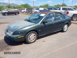 1999 Saturn SL z VIN 1G8ZK5274XZ351289, wystawiony jako IAAI lot #41734679 z przebiegiem 140 006 mil mil oraz . Historia ofert i sprzedaży dostępna na DreamBid. Obrazek 2.