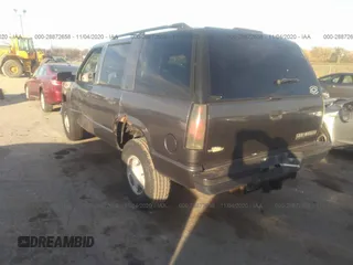 1999 Chevrolet Tahoe Z71 with VIN 1GNEK13R7XJ528100, listed as a IAAI auction lot 28872658 with 158,958 mi miles and . Bid and sale history available at DreamBid. Image 3.
