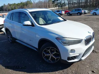2017 BMW X1 xDrive28i with VIN WBXHT3C37H5F69725, listed as a IAAI auction lot 41588095 with 109,704 mi miles. Bid and sale history available at carsss.com. Image 1.