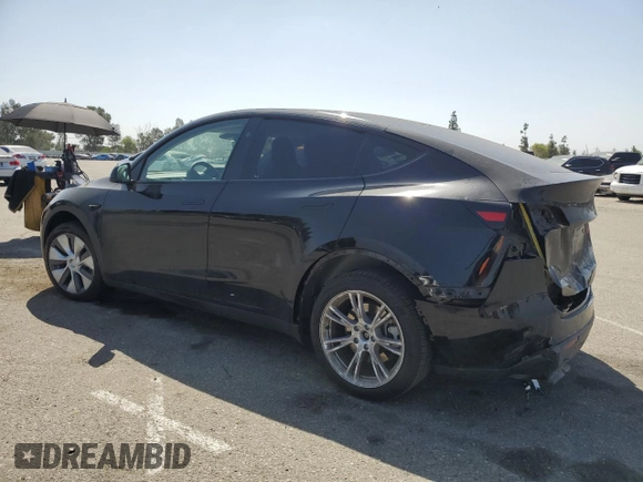 2024 Tesla Model Y Long Range with VIN 7SAYGDEE6RA219456, listed as a Copart auction lot 61855165 with 29,869 mi miles and Salvage title. Bid and sale history available at DreamBid. Image 2.