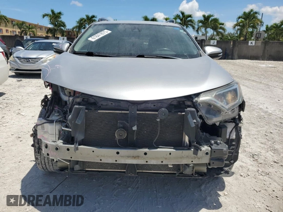 2018 Toyota RAV4 XLE with VIN 2T3WFREV7JW423768, listed as a Copart auction lot 61841875 with 111,991 mi miles and Salvage title. Bid and sale history available at DreamBid. Image 5.