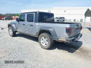 2020 Jeep Gladiator Sport S with VIN 1C6HJTAG7LL128940, listed as a IAAI auction lot 42108154 with 90,596 mi miles and . Bid and sale history available at DreamBid. Image 3.