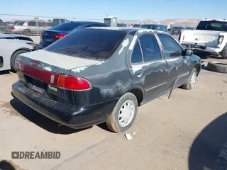 1997 Nissan Sentra XE z VIN 3N1AB41D5VL026257, wystawiony jako IAAI lot #41286097 z przebiegiem 125 583 mil mil oraz . Historia ofert i sprzedaży dostępna na DreamBid. Obrazek 4.