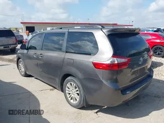 2015 Toyota Sienna XLE with VIN 5TDYK3DC6FS542504, listed as a IAAI auction lot 42569992 with 113,004 mi miles and . Bid and sale history available at DreamBid. Image 3.
