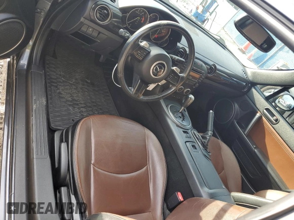 2015 Mazda MX-5 Miata Grand Touring z VIN JM1NC2PF3F0239991, wystawiony jako Copart lot #46989165 z przebiegiem 139 801 mil mil oraz Szkoda całkowita • Salvage title. Historia ofert i sprzedaży dostępna na DreamBid. Obrazek 8.