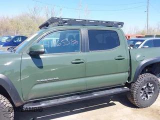 2021 Toyota Tacoma 4WD SR with VIN 3TMCZ5ANXMM382874, listed as a IAAI auction lot 41965388 with 62,178 mi miles. Bid and sale history available at carsss.com. Image 15.
