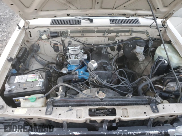 1986 Nissan Hardbody E z VIN JN6ND11S1GW037479, wystawiony jako Copart lot #81775934 z przebiegiem 389 841 mil mil oraz Szkoda całkowita • Salvage title. Historia ofert i sprzedaży dostępna na DreamBid. Obrazek 11.