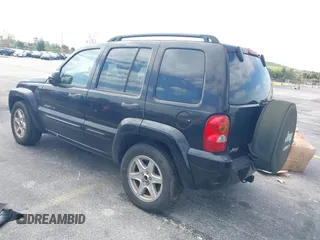 2003 Jeep Liberty Limited with VIN 1J4GK58K13W719457, listed as a IAAI auction lot 42088672 with 179,214 mi miles and . Bid and sale history available at carsss.com. Image 3.
