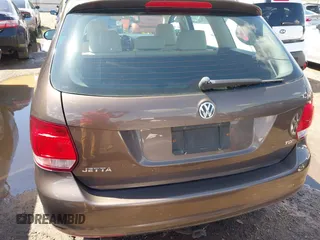 2011 Volkswagen Jetta SportWagen TDI with VIN 3VWPL7AJ2BM672287, listed as a IAAI auction lot 42013933 with 153,378 mi miles. Bid and sale history available at carsss.com. Image 6.