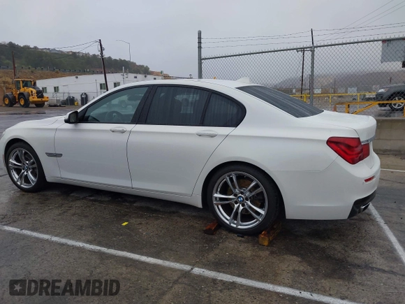 2013 BMW 7 Series 740i with VIN WBAYA6C57DC995338, listed as a IAAI auction lot 41479077 with 123,680 mi miles and . Bid and sale history available at DreamBid. Image 14.